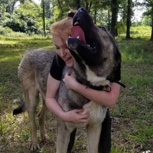owner hugging dog
